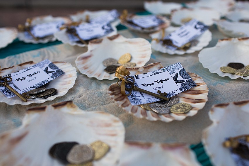 Guests grabbed their dinner keys for their table assignments.