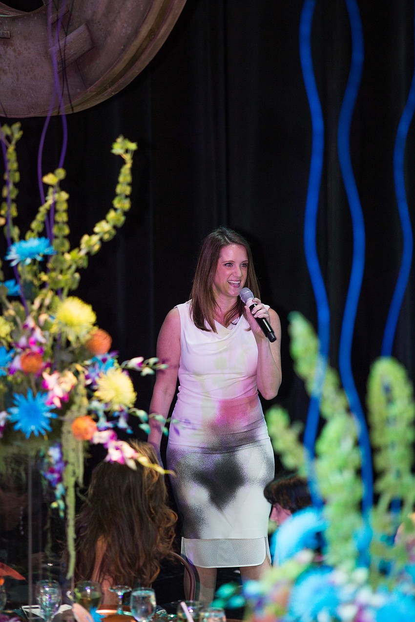 Jen Rust gives a speech before dinner.