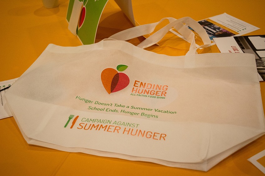 Guests were ask to fill their  Campaign Against Summer Hunger Kick Off  bags with rubber bracelets, posters and cards promoting the campaign.
