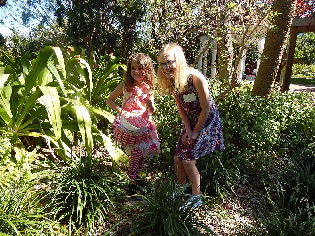 Alahna Smith (left) and Isabelle Cooke (right) have fun finding the hidden eggs. Courtesy photo