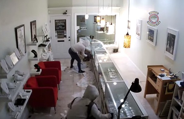 Police said two people in hooded sweatshirts broke into Estate Coin and Jewelry Galleria at 1650 Main Street around 1:30 a.m. March 29. (Sarasota Police)