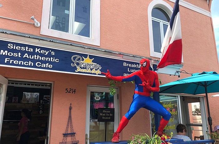 Siesta Key Village restaurant Bonjour French CafÃ© shared a photo of a man in a Spider-Man costume on its Facebook on March 8.