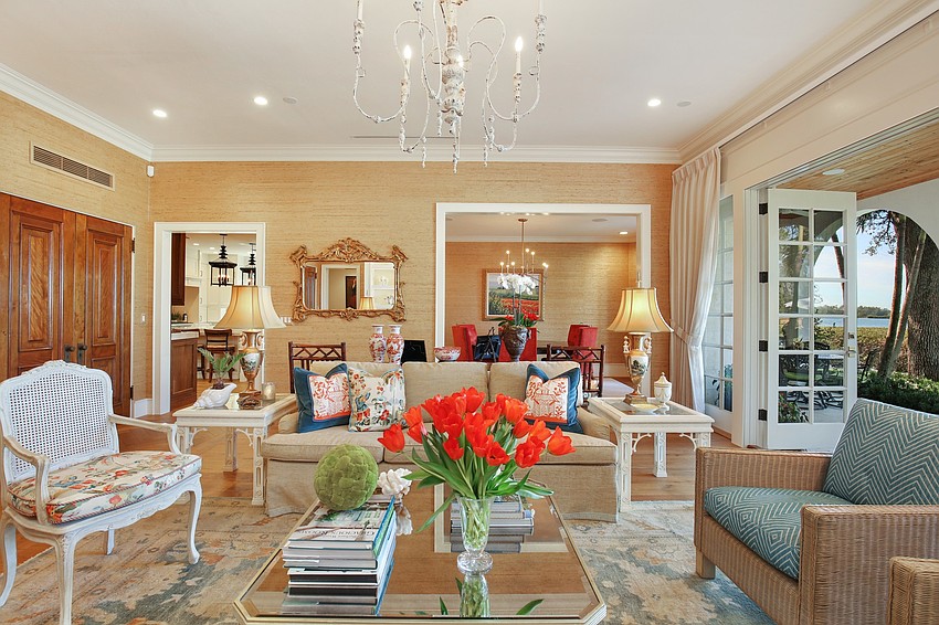 The living room has French doors that lead to the yard and bayfront.
