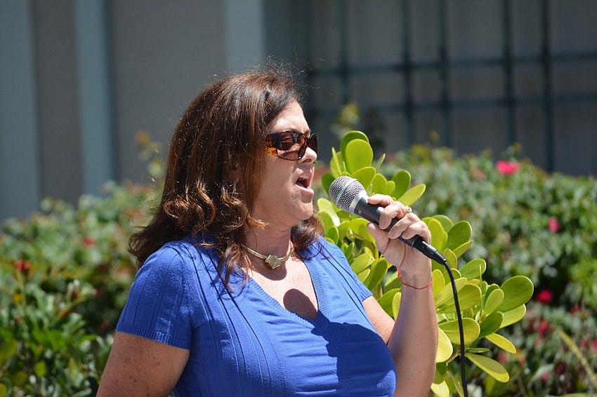 Bradenton's Jennifer Jordan sings The National Anthem before the Rosedale Golf Classic.
