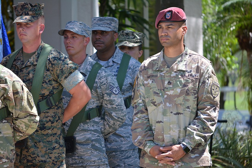 Staff Sgt. Andrew Whitaker, right, was in charge of the honor guard from MacDill Air Force Base. He says, 
