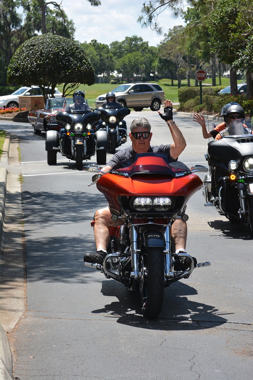 A motorcycle procession led honoree Christopher Gordon to the course.