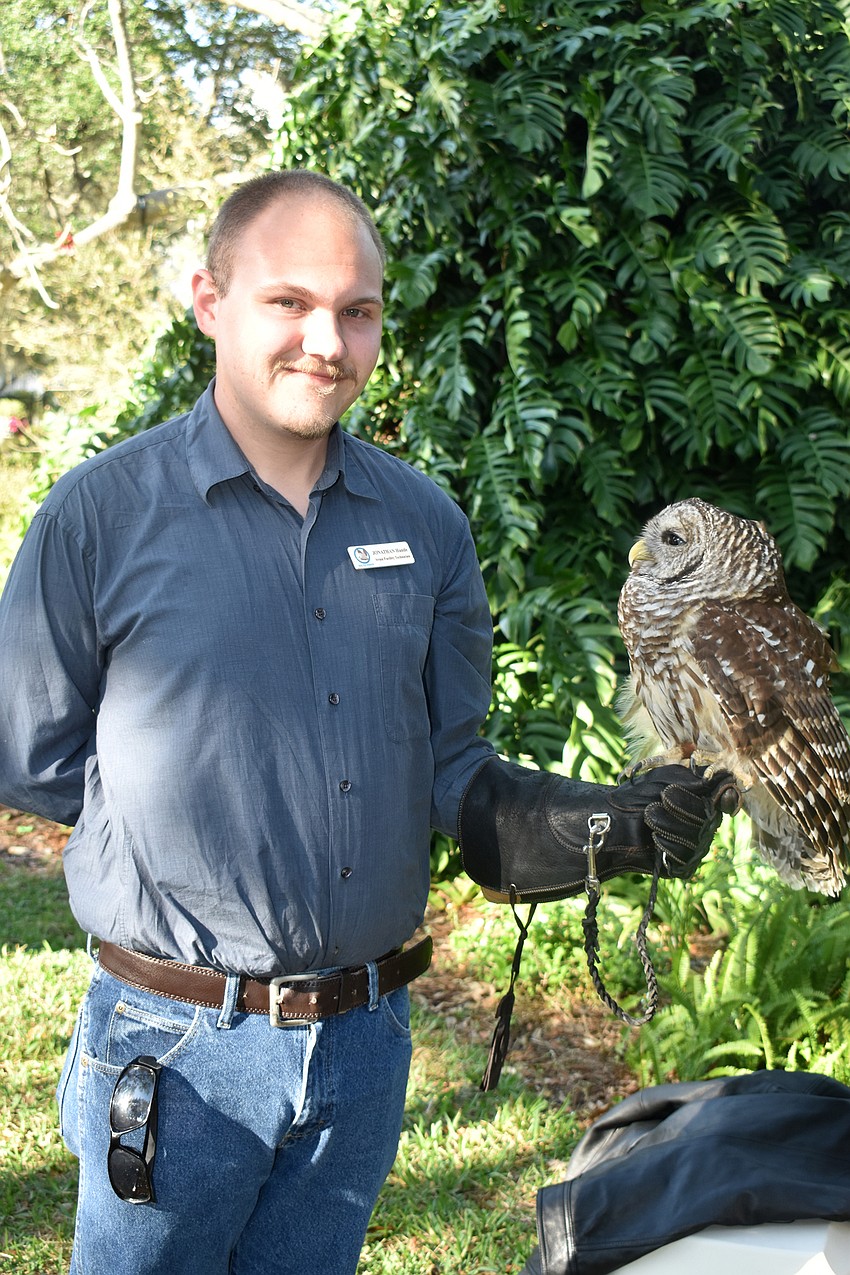 Jonathan Handle holds Nova, a bird from Save Our Seabirds.