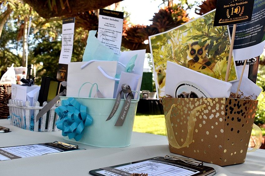 During the cocktail hours, guests bid on various silent auction items.