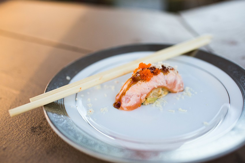 Tsunami Sushi & Hibachi served a salmon sushi.