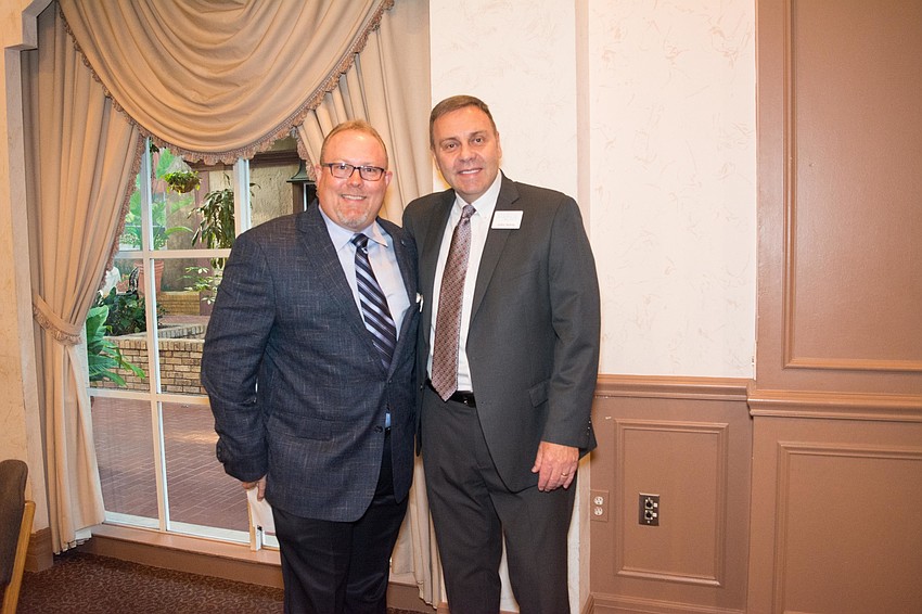 Child Protection Center Executive Director Douglas Stanley with John Annis
