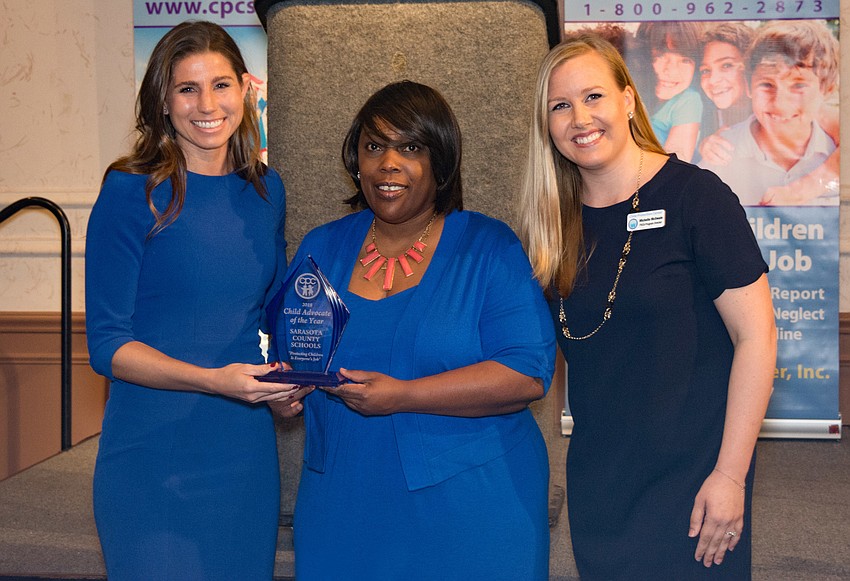 This year's community hero award recipients were school counselors. Morgan Taylor and Pamela Davis-Colkey accepted the award from Michelle McSwain.
