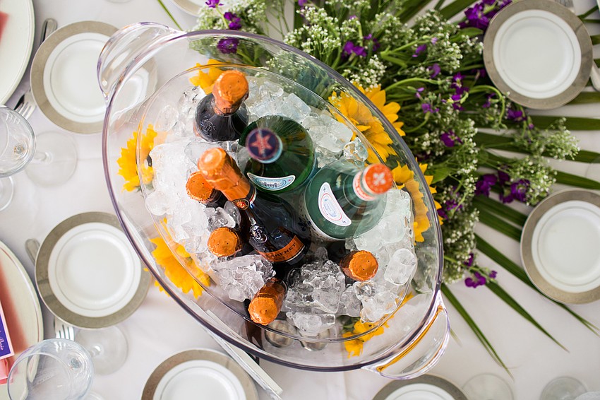 Each table had a few bottles of sparkling water and champagne.