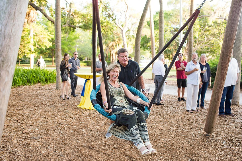 Lynn Barry swings in the swing at the 