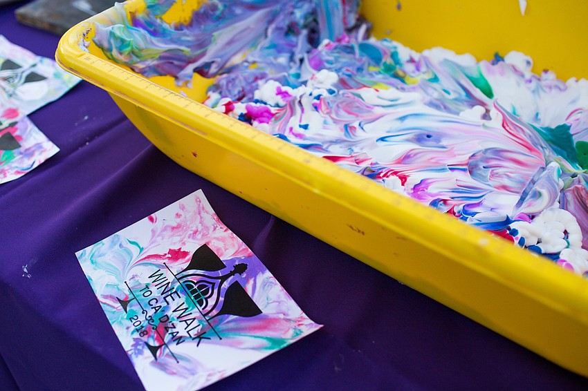 Ringling volunteers made artwork for guests with shaving cream mixed with paint.