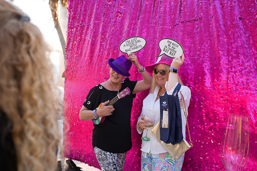 Marilee Lipinski and Scarlett Guy use the photo booth at 