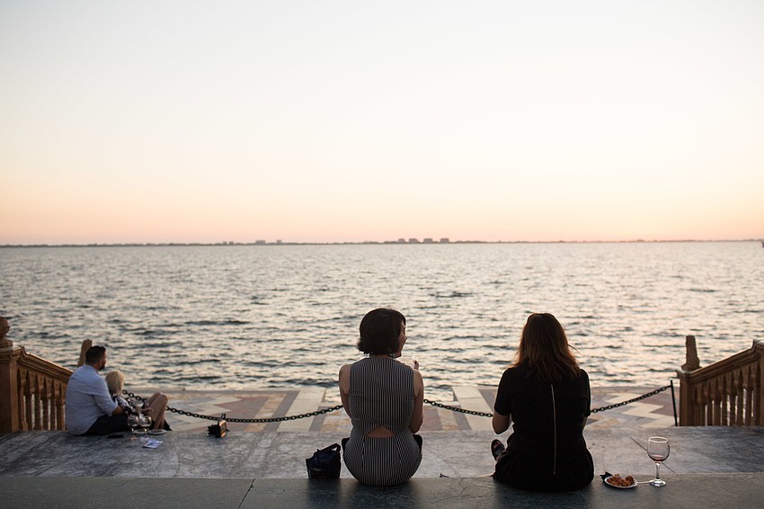 Guests enjoy the view from the Ca' d'Zan terrace.
