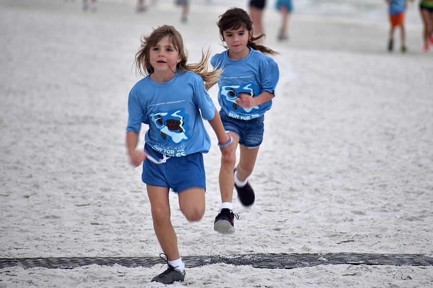 Brooke and Chloe Cicilioni finish the 1-mile fun-run/walk.