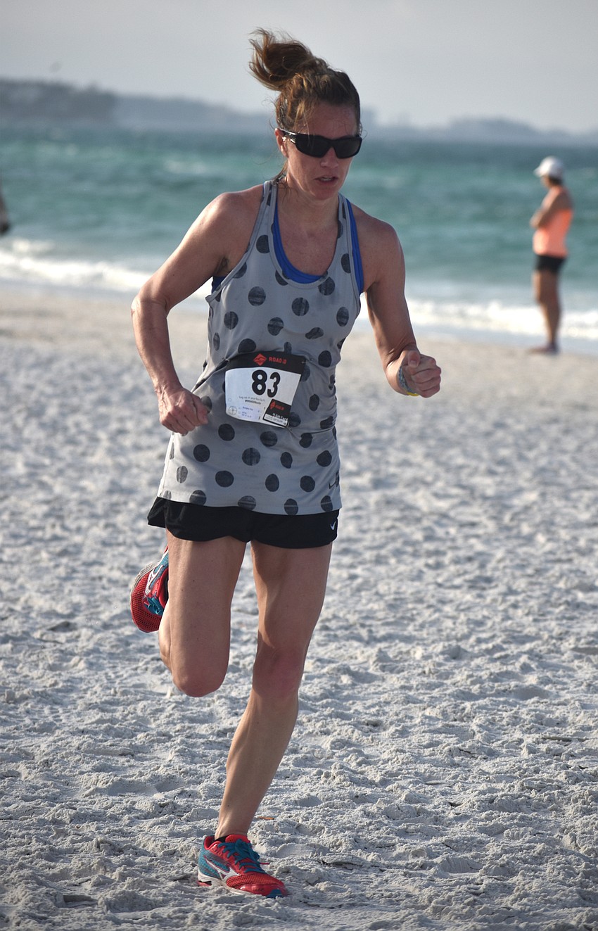 Kristy Burgess finishes the 5K.