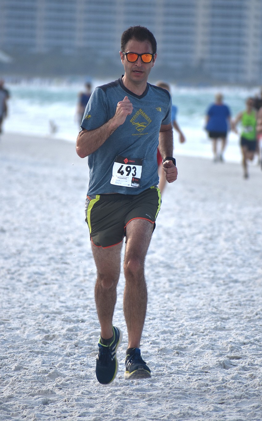 Jeff Polino finishes the 5K.