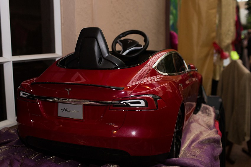 A children's Tesla car was donated for the auction.