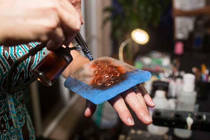 Suzy Kalin put temporary tattoos on guests.