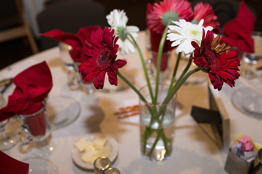 Red and white flowers decorated the tables.
