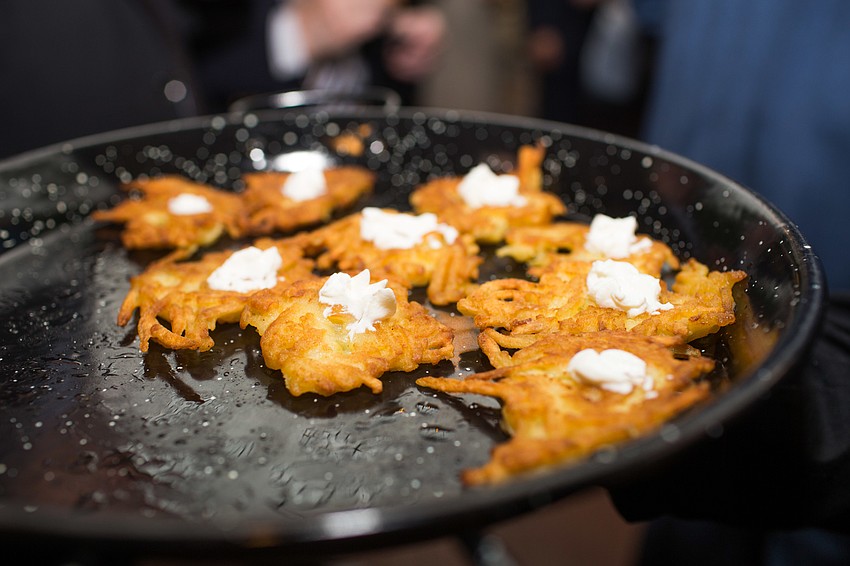 Potato pancakes with sour cream were served during cocktail hour.