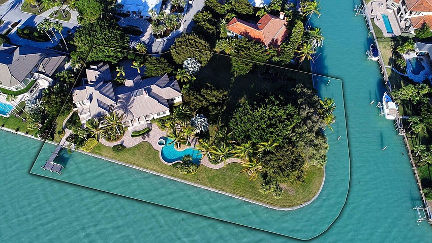 The home and lot, situated at 622 and 626 S. Owl Drive, offers 230 feet of water frontage and more than 54,000 square feet of property.