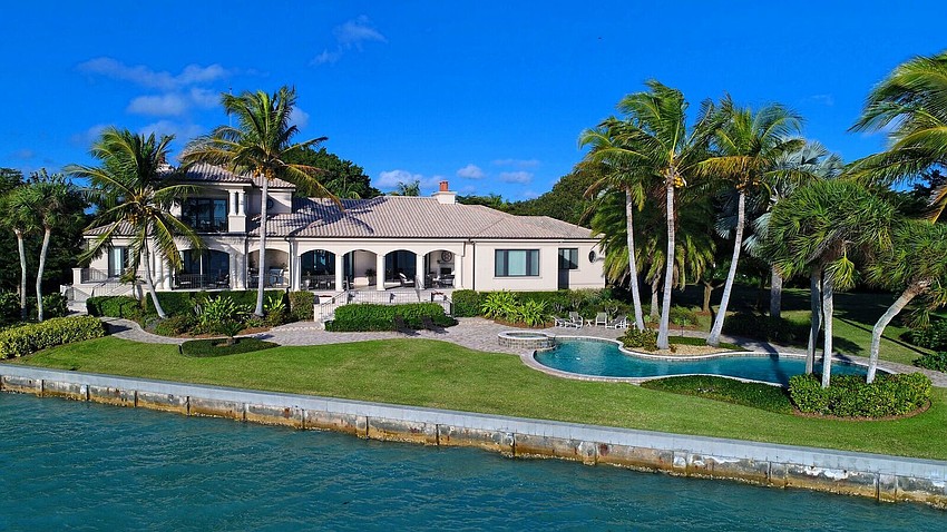 The home and lot, situated at 622 and 626 S. Owl Drive, offers 230 feet of water frontage and more than 54,000 square feet of property.