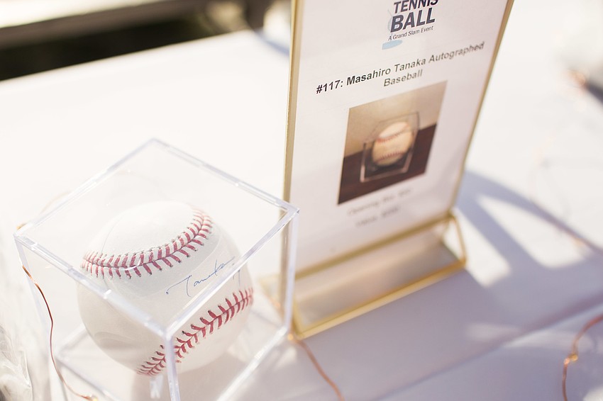 Sports-themed items were available in the silent auction, such as this baseball signed by Masahiro Tanaka.