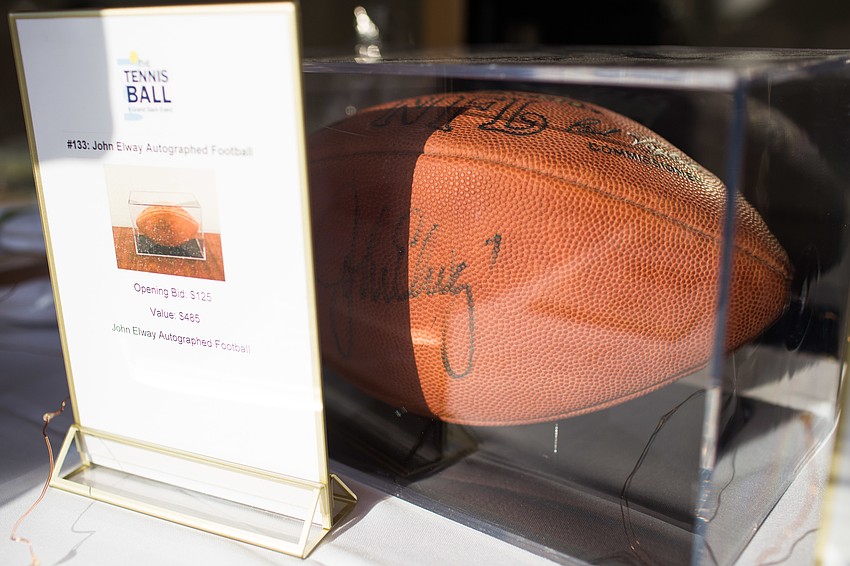 A football signed by John Elway was a silent auction item.