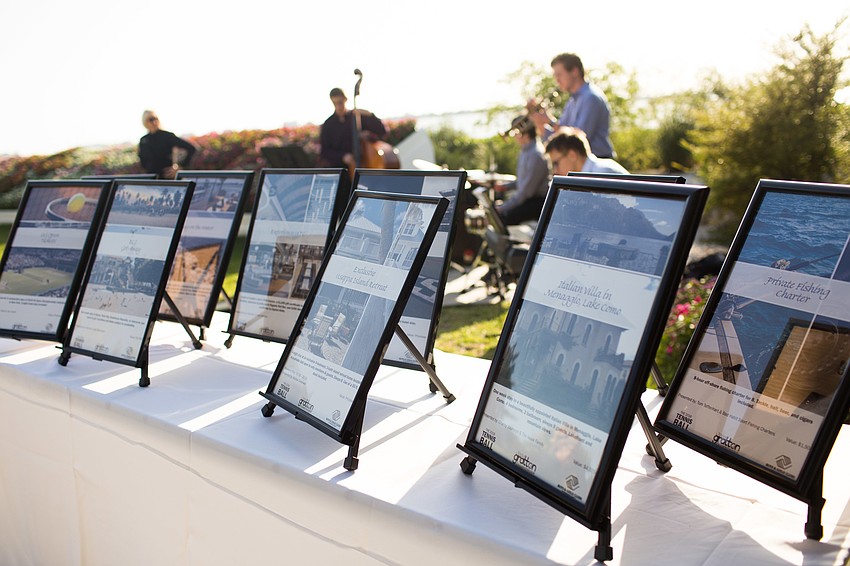 A table lined with live auction items, such as Orioles tickets, excursions and two tickets to the MLB World Series.