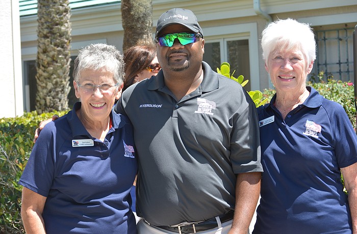 Deb Kehoe and Kathi Skelton flank Staff Sgt. Christopher Gordon, who was honored during the 2018 Rosedale Golf Classic.