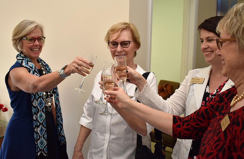 Roxie Jerde, Jean Volpe, Anna Passalaqua and Marjorie Floyd toast after the dedication ceremonies.