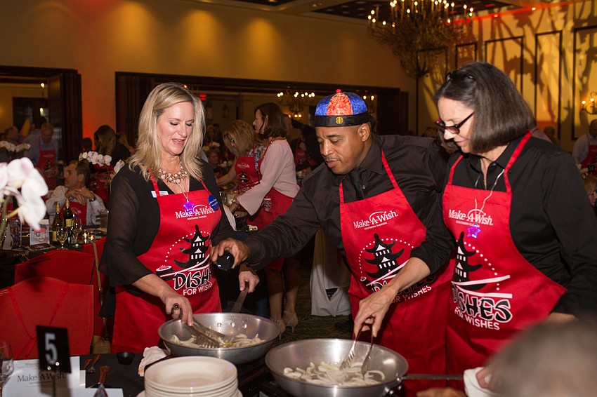 Lisa Andrews, Joshua James and Lena Sciturro cook up the second course.