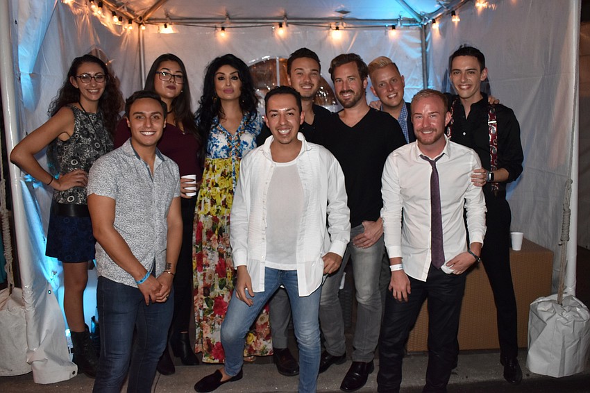 The SarasotaOUT team and friends enjoy their media sponsor tent.