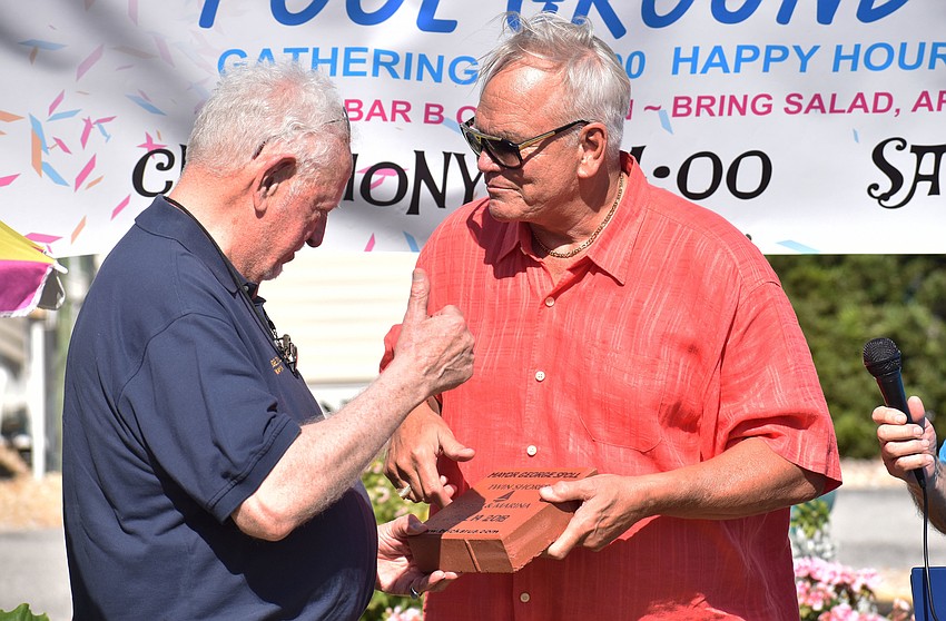 Mayor George Spoll is recognized with a memorial brick by Jim Boltz.