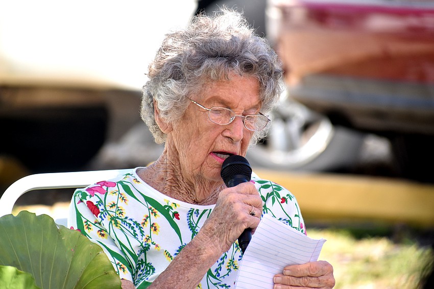 Amy Parks, a longtime resident of Twin Shores, shares her story with the crowd.