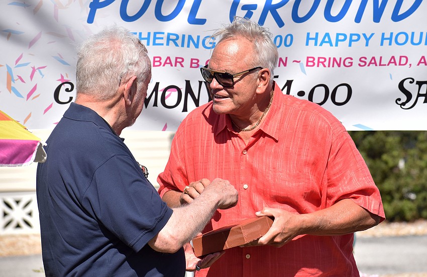 Mayor George Spoll is recognized with a memorial brick by Jim Boltz.