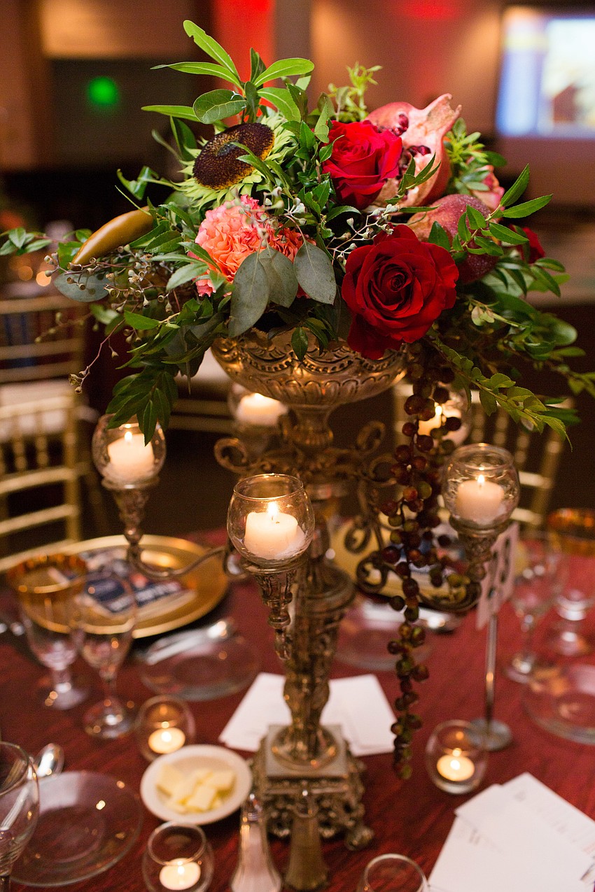 Elegant floral bouquets centered the tables.