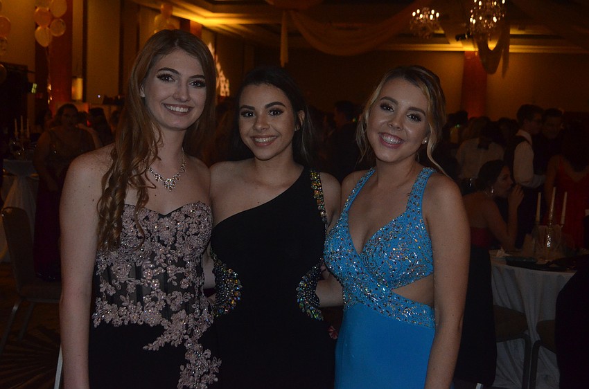 Carol Bado, Katie Maxham and Sidney Oake, seniors, get ready to dance all night.