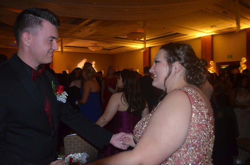 Matthew Scott and Kyndra Mcleod, seniors, take a spin on the dance floor.