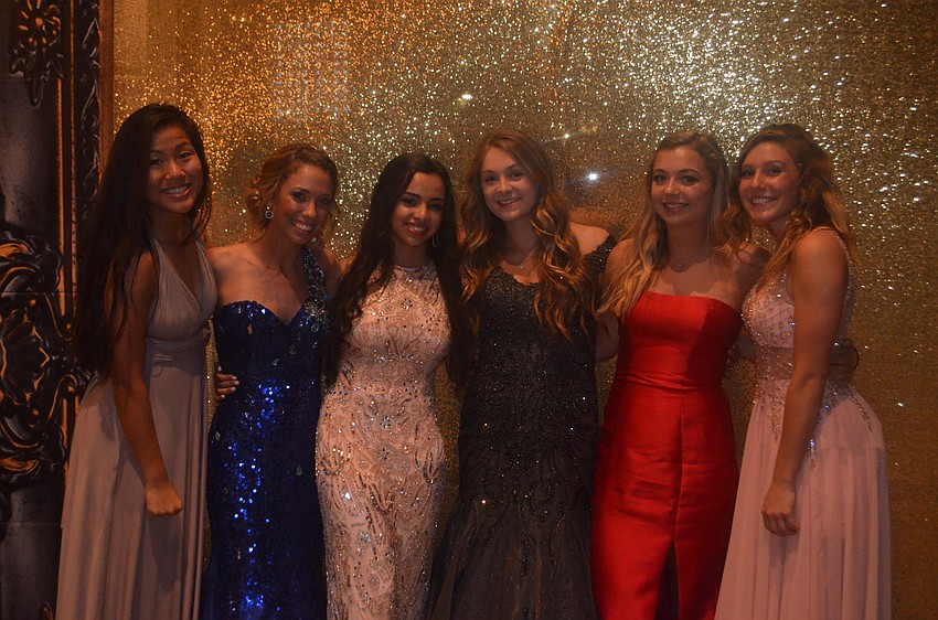 Juniors Ashley Ringo, Anna Thomas, Haley Klein, Sienna Rodriguez, Ashley Phillips and Brenna Rodemaker pose for a photo at the prom.