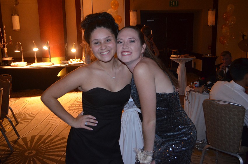 Juniors Jalyn Thompson and Julianna Catena take a break from the dancing at the prom.