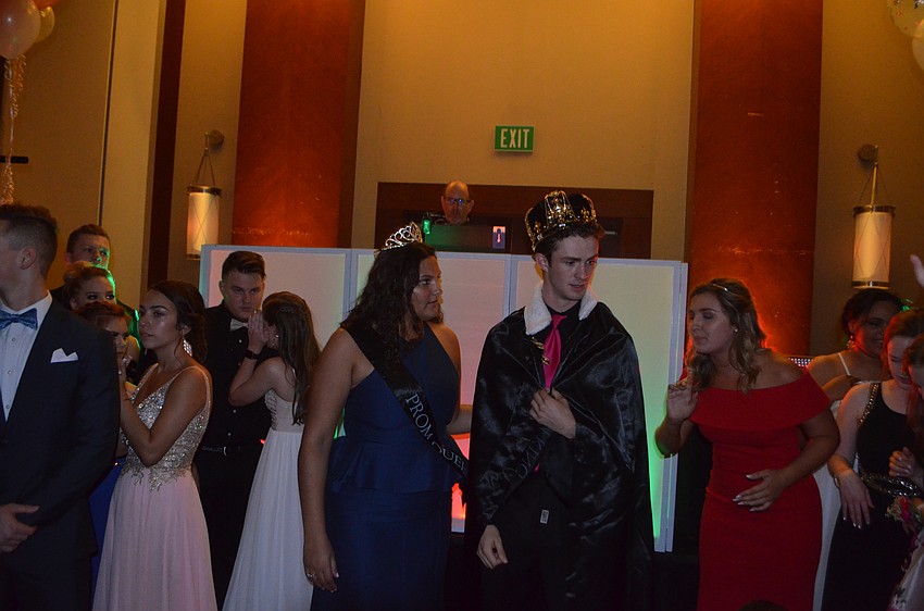 Prom queen Kailey Carpenter and prom king Matthew Dugan don their crowns and Dugan got a cape.