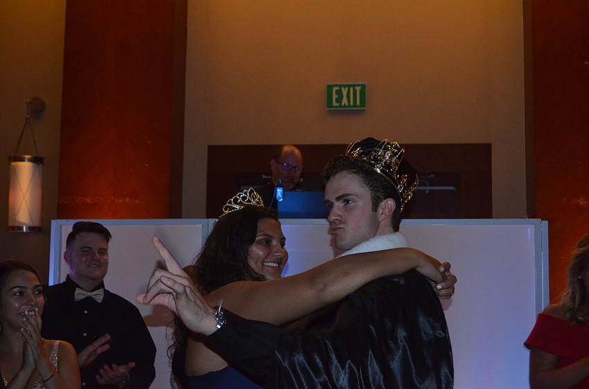 Kailey Carpenter and Matthew Dugan dance after they are named prom king and queen.
