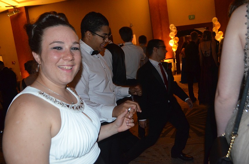 Seniors Cheyenne Helbrecht and Evan Schulz dance to the cupid shuffle, a popular dance at the prom.