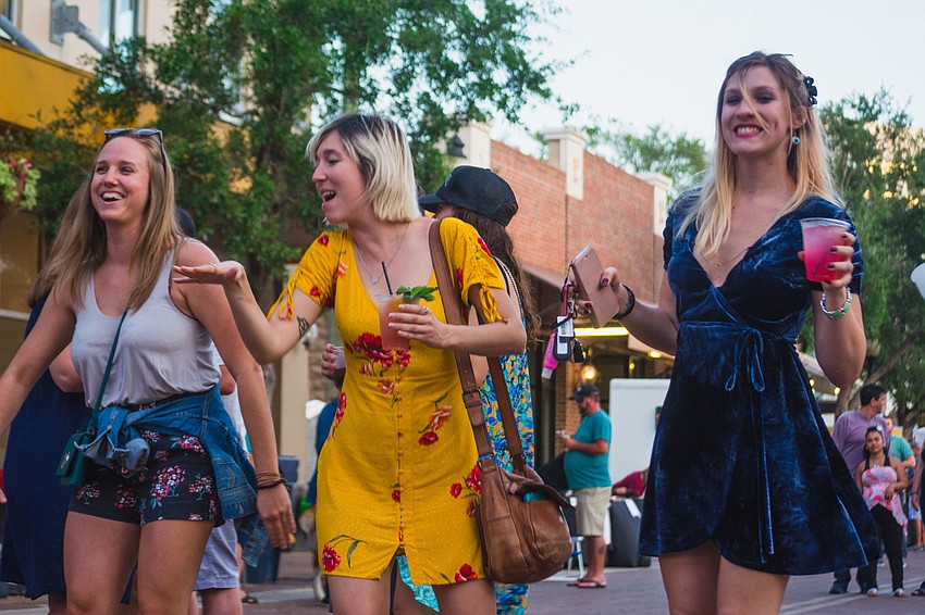 Gina White, Lesa Silvermore and Corinne Culver get down to tunes from Physical Plant.
