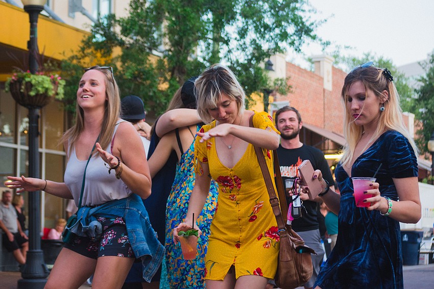 Gina White, Lesa Silvermore and Corinne Culver get down to tunes from Physical Plant.