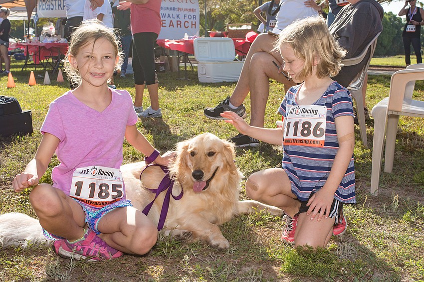 Charlotte Tommey with her dog, Lilly, and Kate Daust